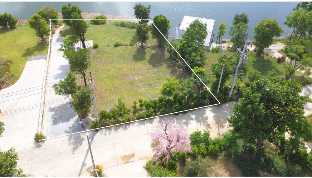 For SaleLandNakhon Pathom : Waterfront land for sale, Nakhon Pathom, 306.6 square meters, next to a pond, level, Khao Yai atmosphere.