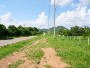 For SaleLandCha-am Phetchaburi : Beautiful plot of land with mountain views, next to a paved road, surrounded by a fence. On the tourist route 182 rai Kaeng Krachan, Phetchaburi