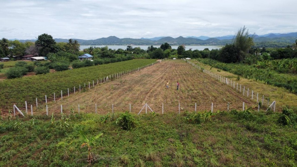 For SaleLandKanchanaburi : Land for sale in a prime location, beautiful view of mountains surrounding the area, with a view of the water, Sri Sawat District, Kanchanaburi Province